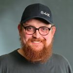 My profile picture, a bearded man wearing a baseball cap.